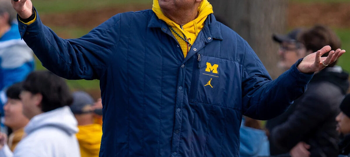 Why has Michigan kept AD Warde Manuel through all the scandals?