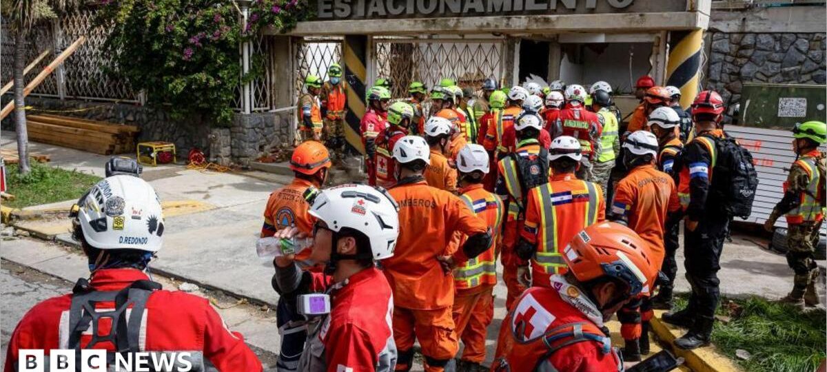 Rescuers inch closer to quake survivor after eight days - and he's cheering them on