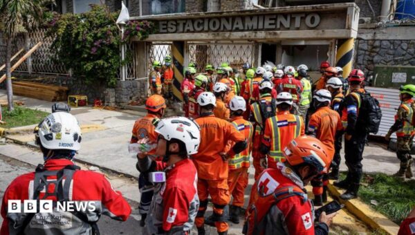 Rescuers inch closer to quake survivor after eight days – and he’s cheering them on
