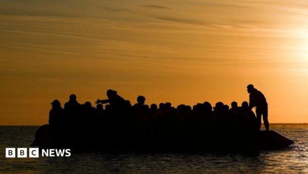 Record 128 people cross Channel in one small boat