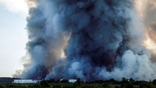 Ukrainian Strikes On Russian Warehouses Kill Eight, Shroud Skies In Smoke