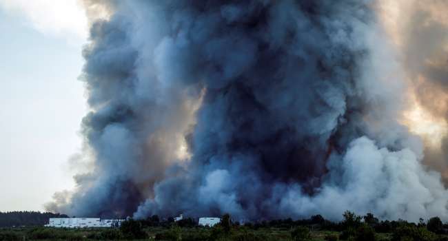 Ukrainian Strikes On Russian Warehouses Kill Eight, Shroud Skies In Smoke