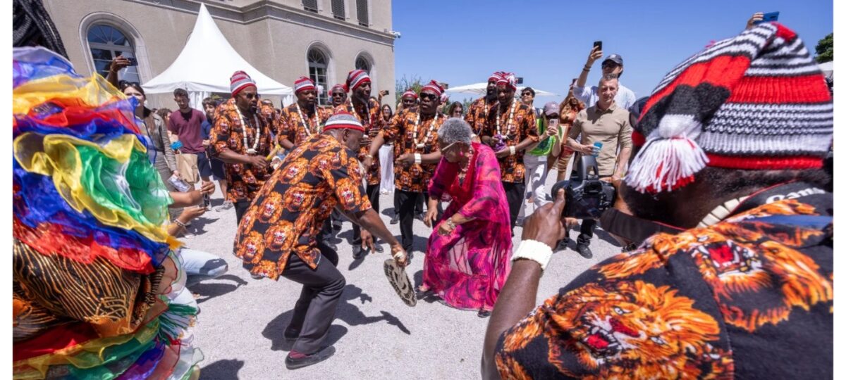 Okonjo-Iweala dances with Igbo masquerades at WTO Open Day in Switzerland [VIDEO]
