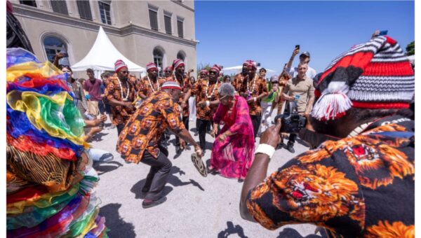 Okonjo-Iweala dances with Igbo masquerades at WTO Open Day in Switzerland [VIDEO]