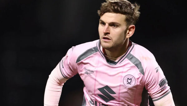 Rochdale sign former MK Dons defender Maguire