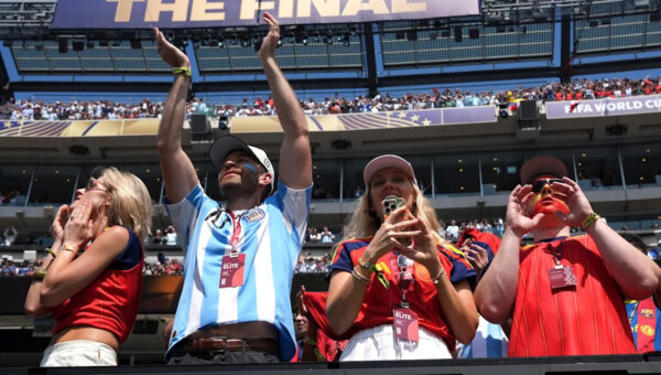 They sing, they stomp, they dance. World Cup fans from Argentina, Spain spent cash at the final