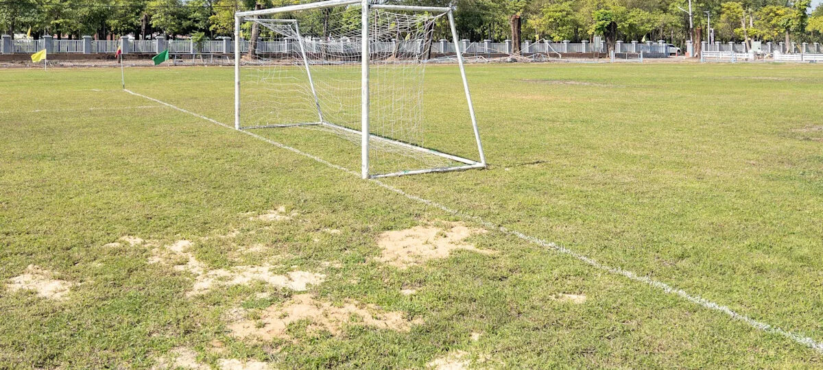 Football pitches ‘like concrete’ due to extreme heat, say clubs