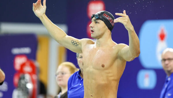 Ilya Kharun, in the process of switch from Canada, wins U.S. title in 50m butterfly over Caeleb Dressel