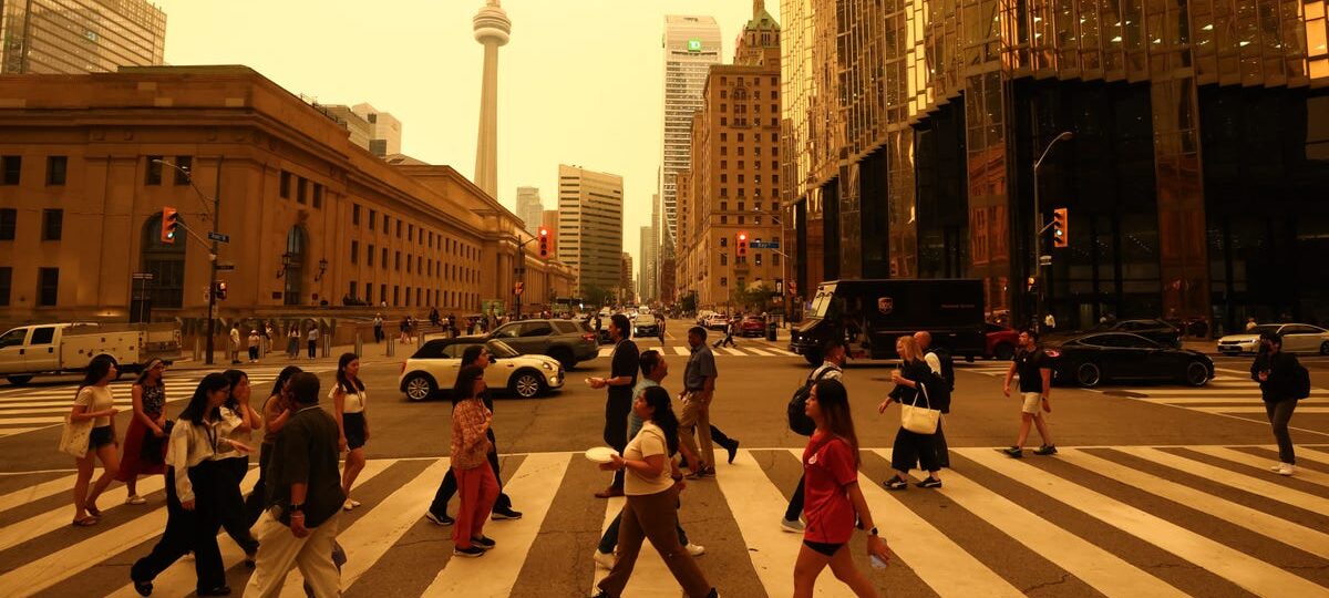 Canadian wildfires are shrouding US cities in smoke and yellow haze. See the eerie photos.