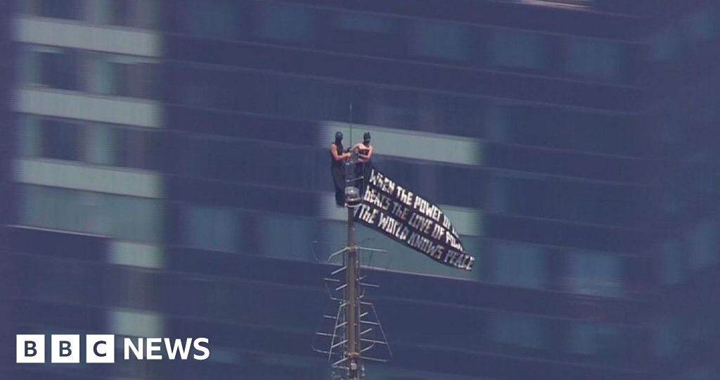 Watch: Two people climb to highest point of Empire State Building