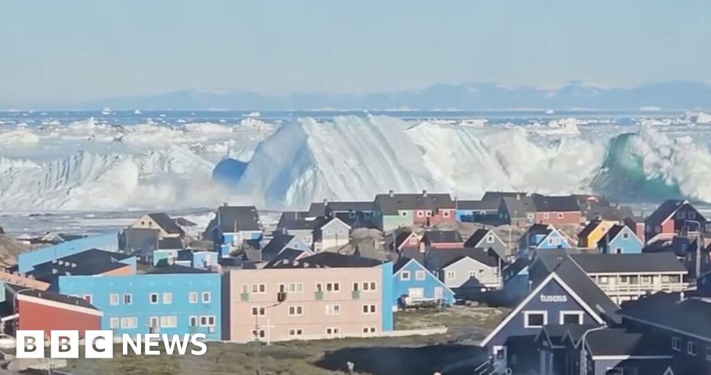 Watch: Giant iceberg turns over near Greenland's coast