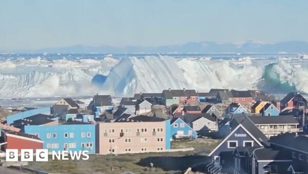 Watch: Giant iceberg turns over near Greenland’s coast