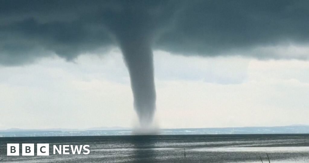 Moment huge waterspout twirls over lake in Germany