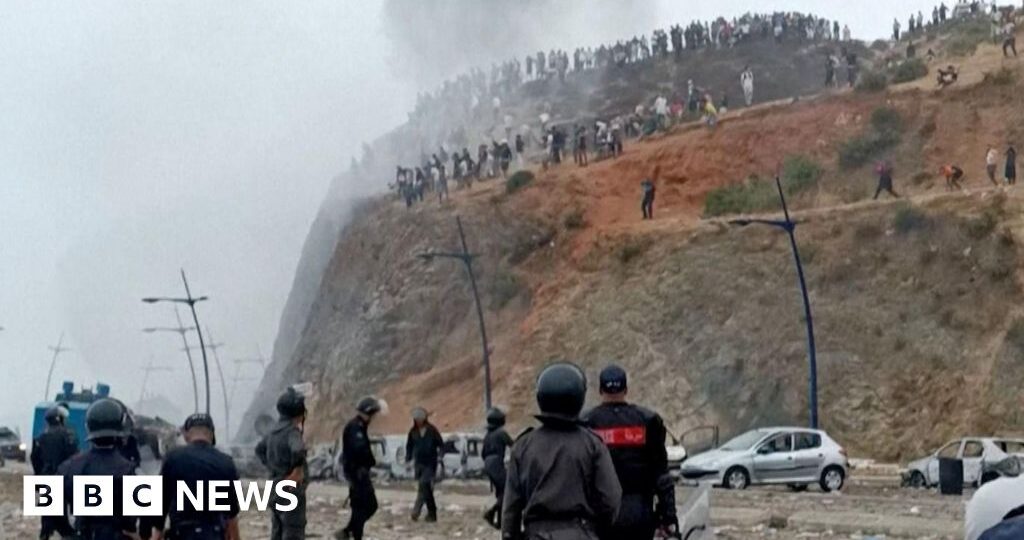 Watch: Moroccan police clash with migrants near border with Spain's Ceuta