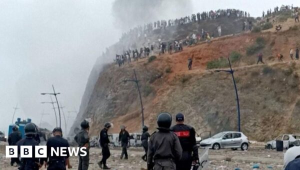 Watch: Moroccan police clash with migrants near border with Spain’s Ceuta