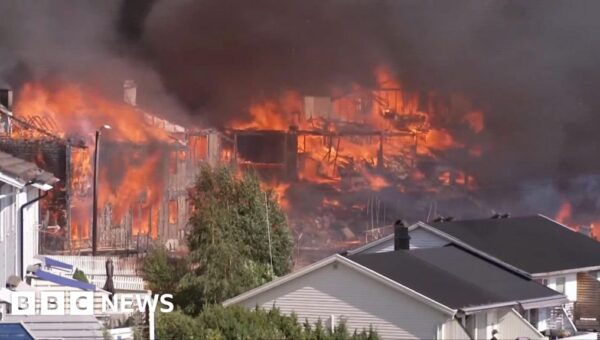 Watch: Helicopters dump water as huge Norway fire destroys homes