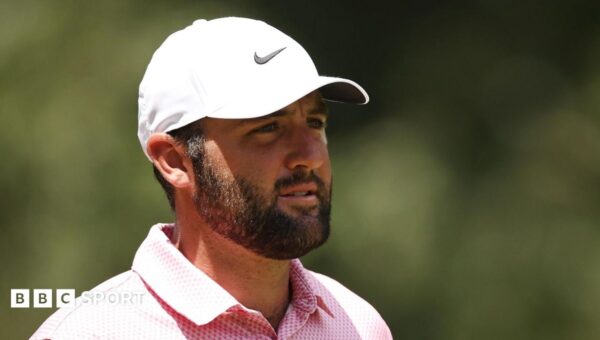 Scheffler equals course record to lead first play-off event
