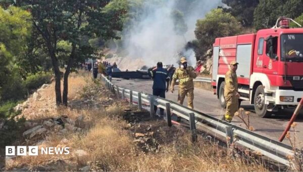 Two crew killed after firefighting helicopters collide in Greece, as British pilot survives