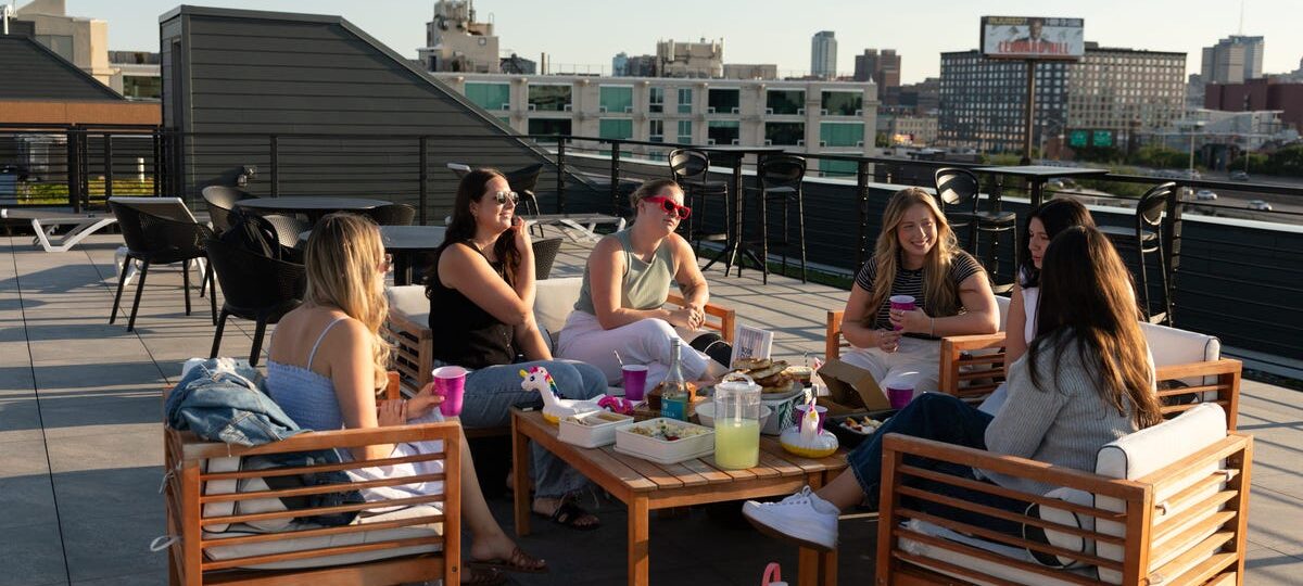 Third places are out, as prices rise. Hosting dinners, craft nights, and book clubs are in.