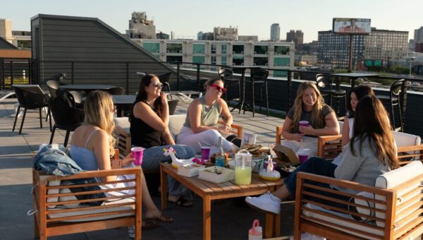 Third places are out, as prices rise. Hosting dinners, craft nights, and book clubs are in.