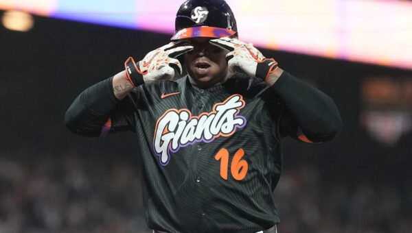 Rafael Devers bounces a homer into McCovey Cove as Giants beat Reds 3-1