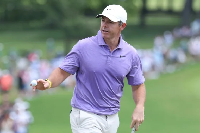 Hovland takes solo lead as McIlroy surges at Tour Championship