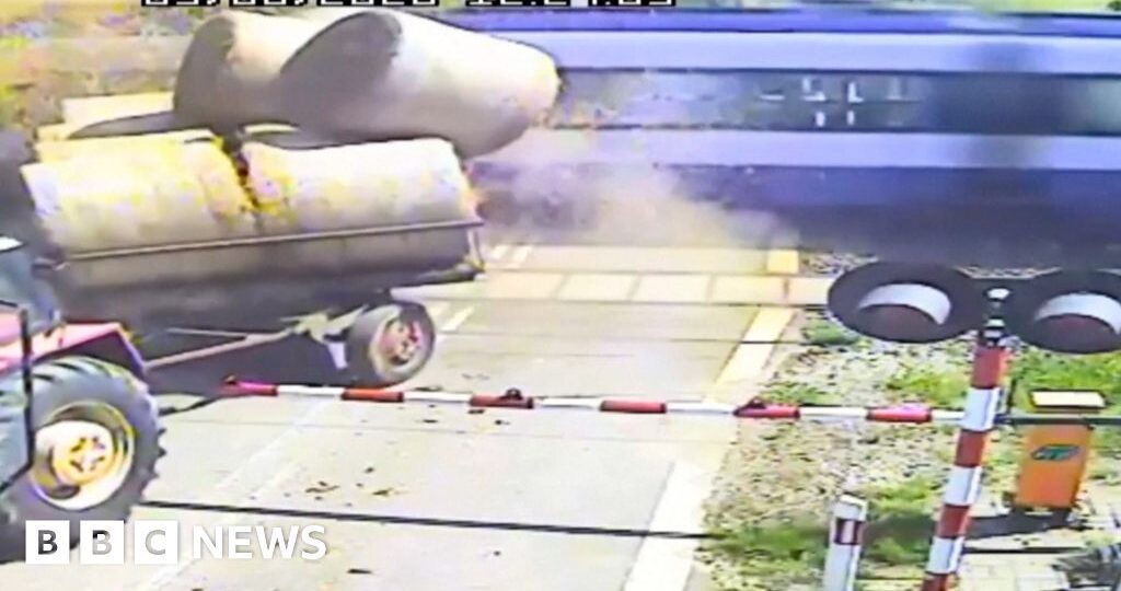 Watch: Moment passenger train crashes into trailer carrying straw bales