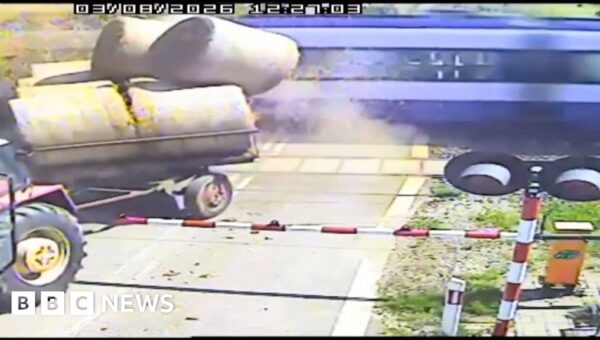 Watch: Moment passenger train crashes into trailer carrying straw bales