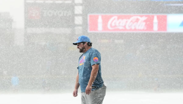 Sugano helps the Rockies beat the Royals 3-1 in game delayed at start by hailstorm
