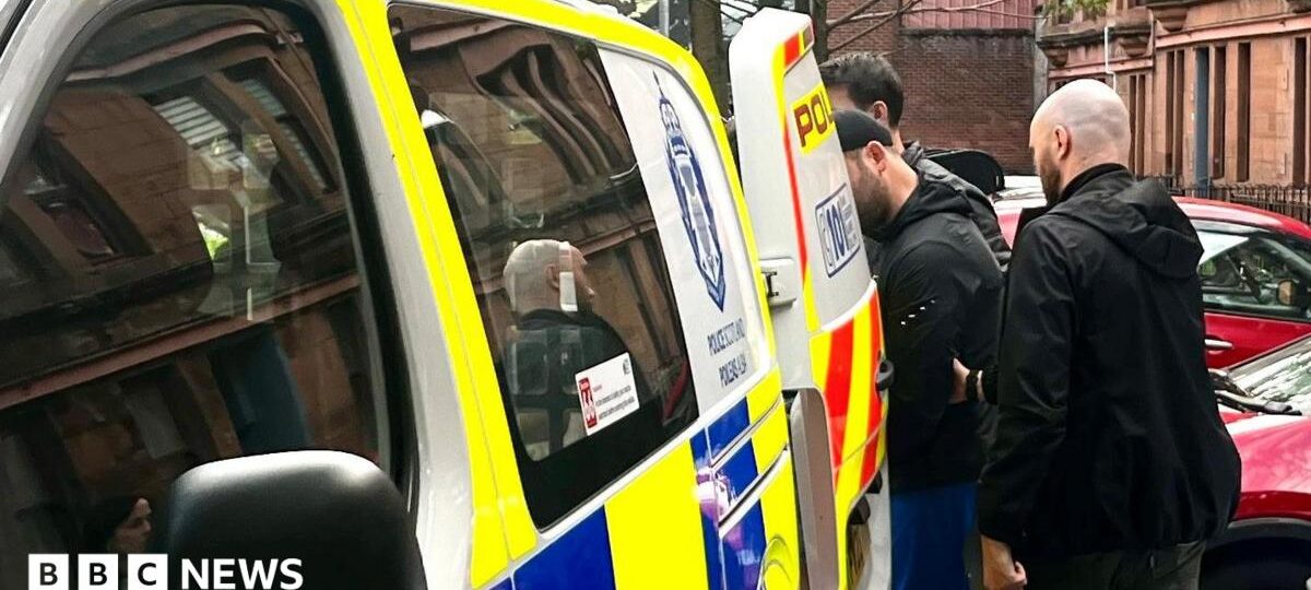 Man, 29, arrested in police raid over racist traffic-cone attack