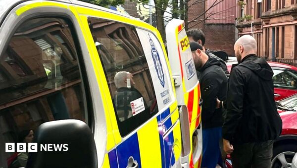 Man, 29, arrested in police raid over racist traffic-cone attack