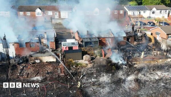 Streets evacuated after massive fire destroys homes