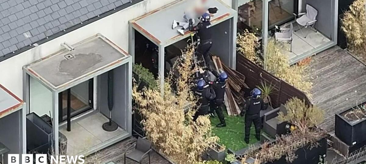 Watch moment police arrest wanted man while he slept on roof