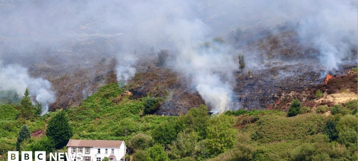 Fires started 'deliberately' on mountain as crews tackle blaze