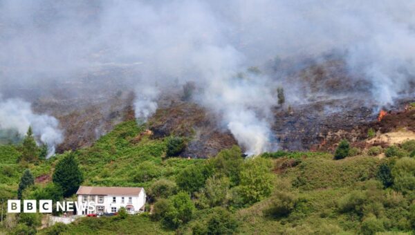 Fires started ‘deliberately’ on mountain as crews tackle blaze