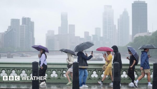 Heavy showers and thunderstorms bring risk of flash flooding to UK