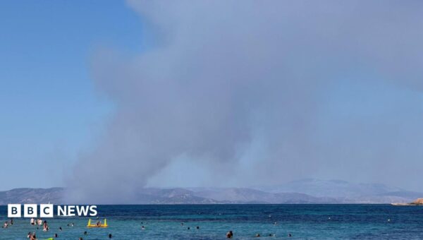 Two dead and evacuation under way as fires break out on Greek island