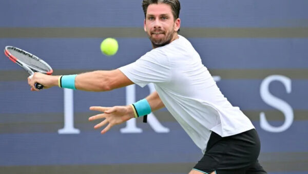 Battling Norrie survives match point to oust de Minaur