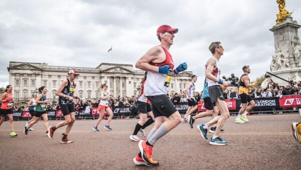 One runner spent $40,000, another took a second job. Marathoners are making big sacrifices to chase medals worldwide.