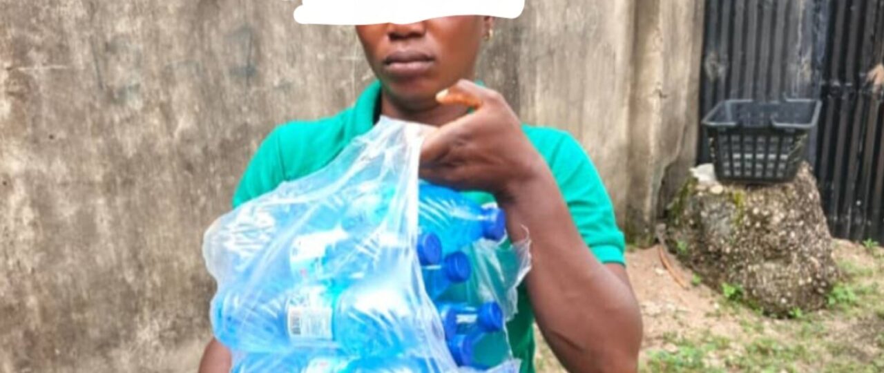 Woman caught smuggling alcohol disguised as bottled water to inmate in Ogun