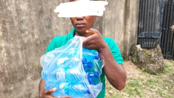 Woman caught smuggling alcohol disguised as bottled water to inmate in Ogun