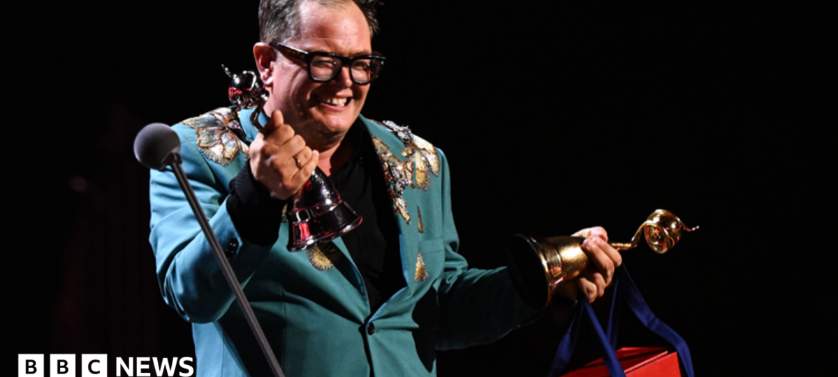 Alan Carr holds back tears on special night at National Television Awards