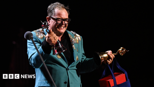 Alan Carr holds back tears on special night at National Television Awards