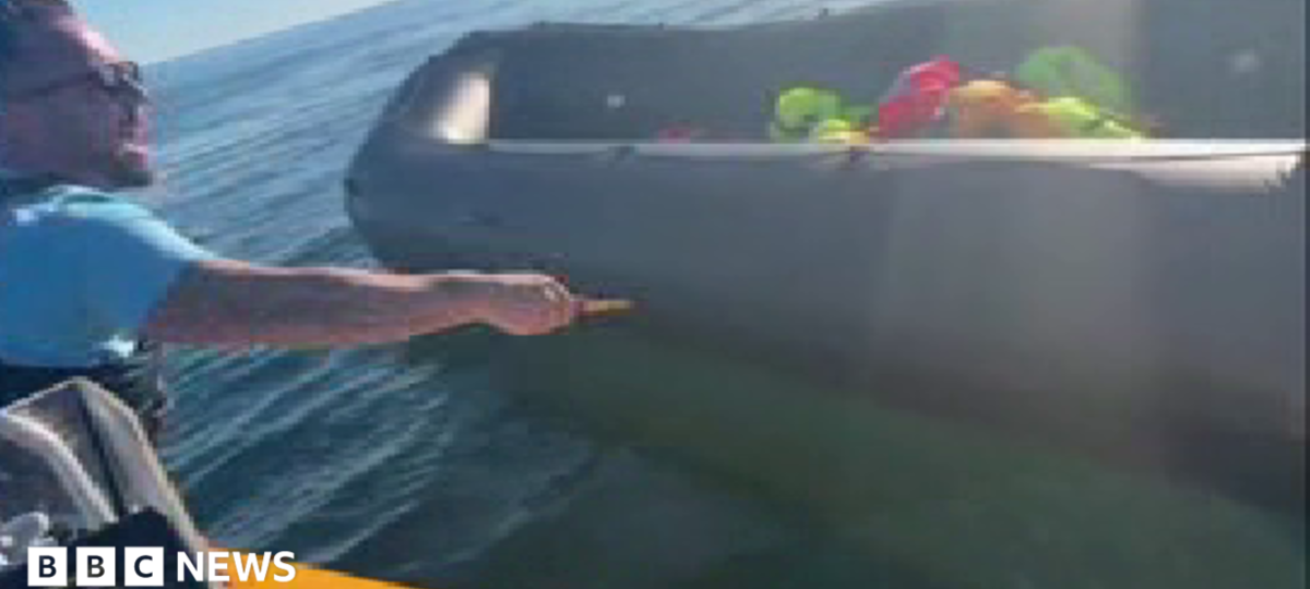 Police examine video of anti-migrant activist slashing dinghy with knife