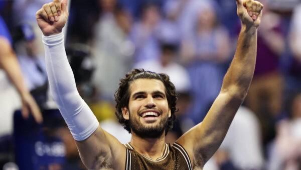 Carlos Alcaraz recovers after dropping the first set to reach the second round at the US Open