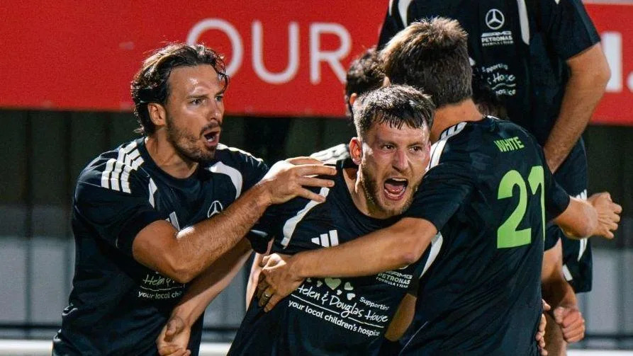 F1 rivals battle it out in charity football games