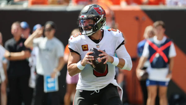Baker Mayfield falls against former team