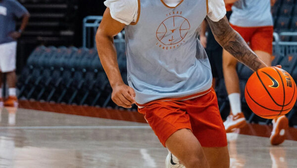 Texas G Mikey Lewis fractured his foot in practice