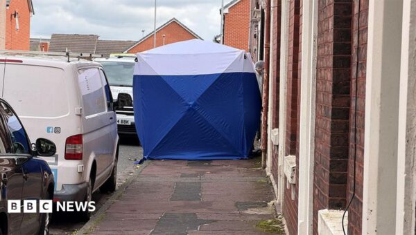 Man arrested on suspicion of murder after two people found dead at house