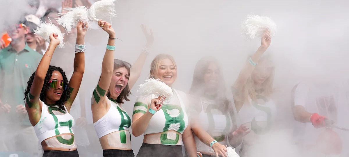 No. 1 Miami, in its first game atop AP poll since 2002 season, rolls past Pitt 52-23